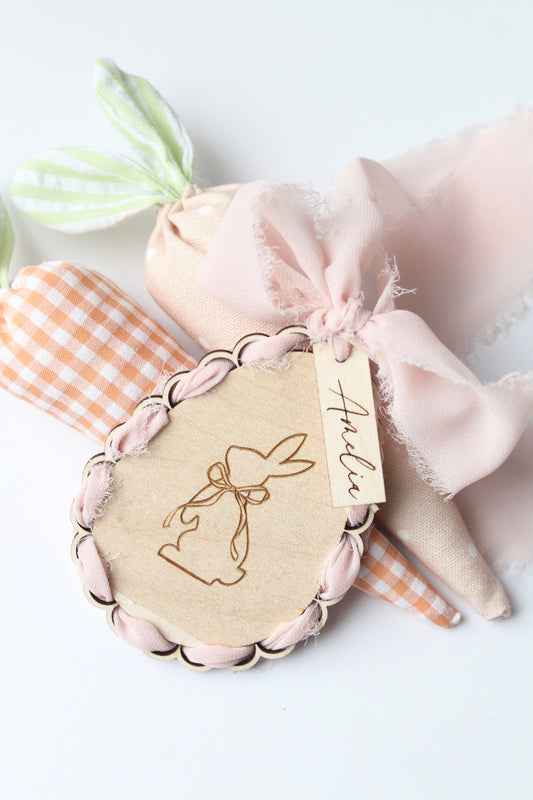ribbon woven through outer tag of wooden custom tag