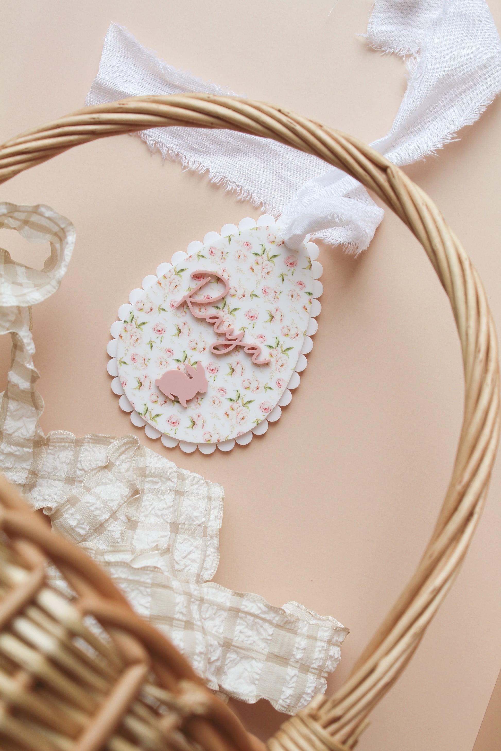 pink and floral acrylic personalized easter tag shaped as easter egg